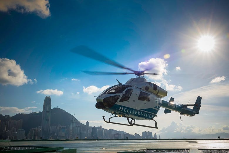 Helicopter taking off into the skies above Hong Kong