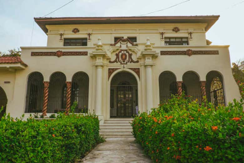 See large Neoclassical mansions with wide front gardens