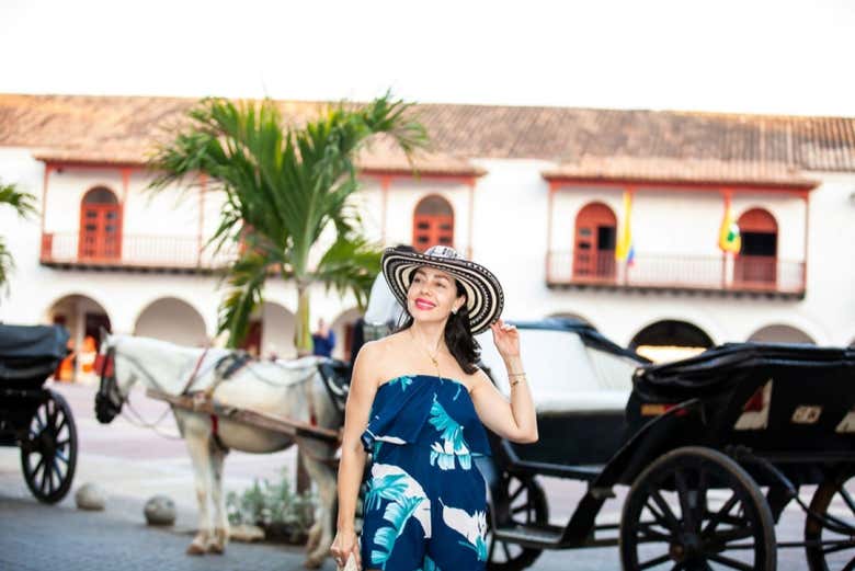 Tirando uma foto ao lado da charrete