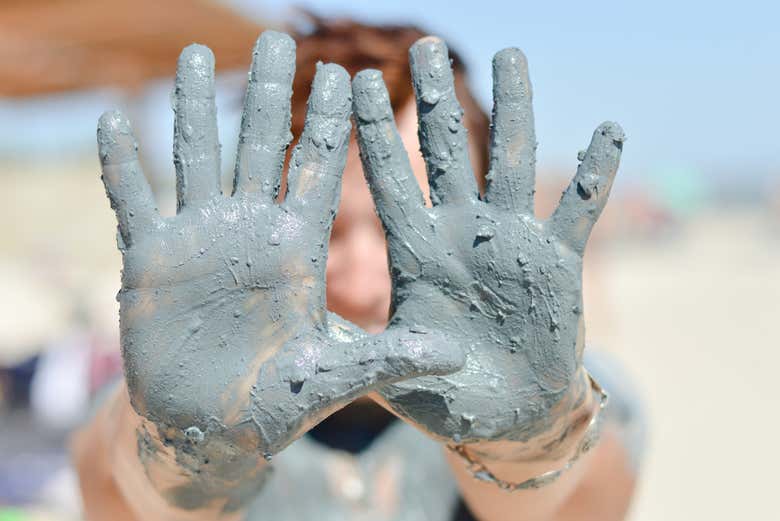 Enjoying bathing in the blue clay