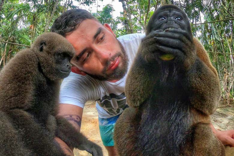 Playing with monkeys in the Mocagua Monkey Sanctuary