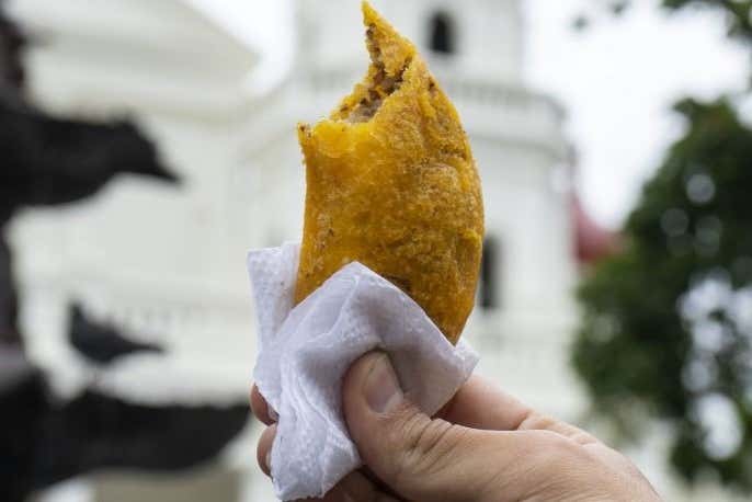 Trying an empanada