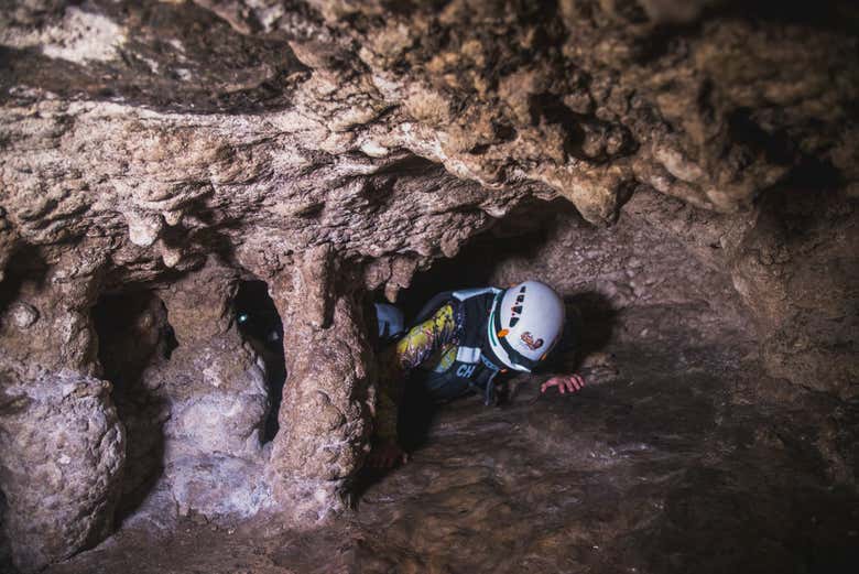 Sliding through the cracks in the cave