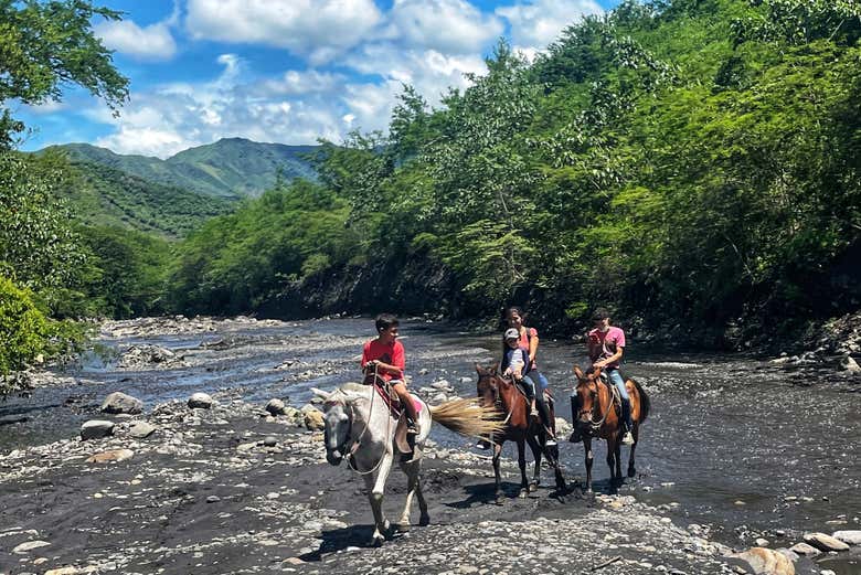 Crossing the Gualivá River on horseback