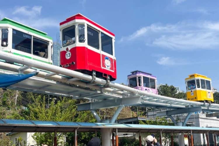 Ride the colorful Beach Train along the coast