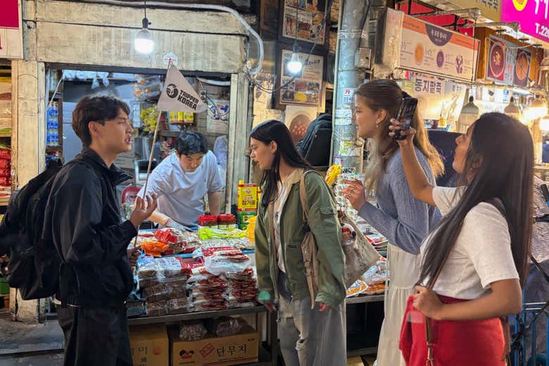 Wander through the colorful stalls of Gwangjang Market