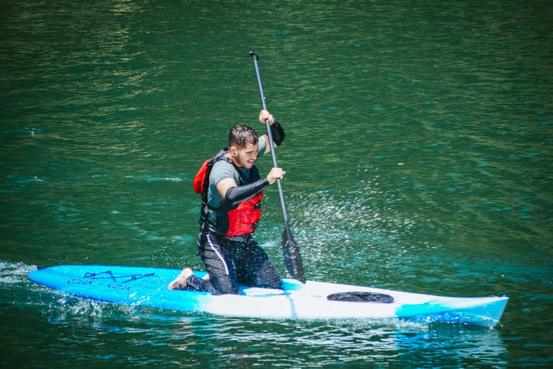 Paddle surf sitting down if standing up is too tricky