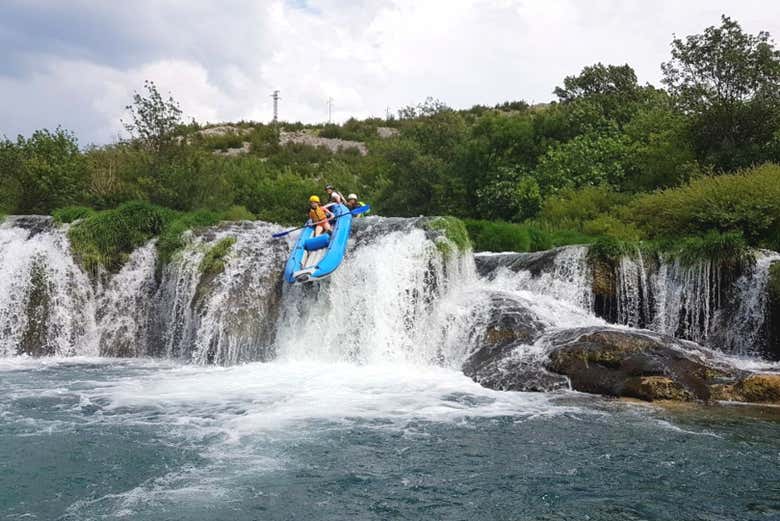 Go over different waterfalls in a raft