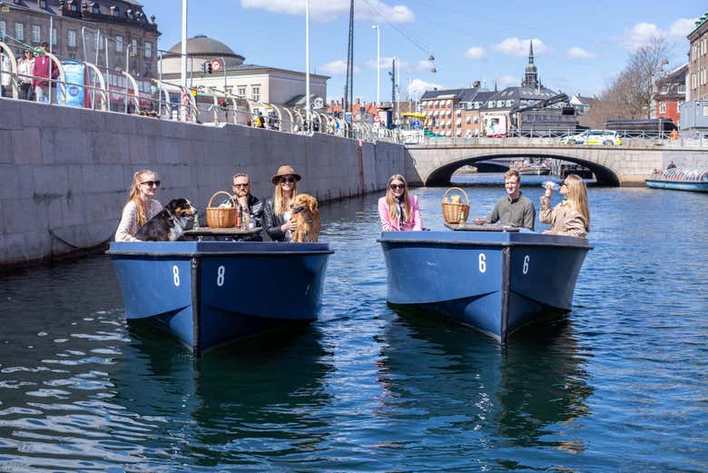 Family with their dogs on the boat 