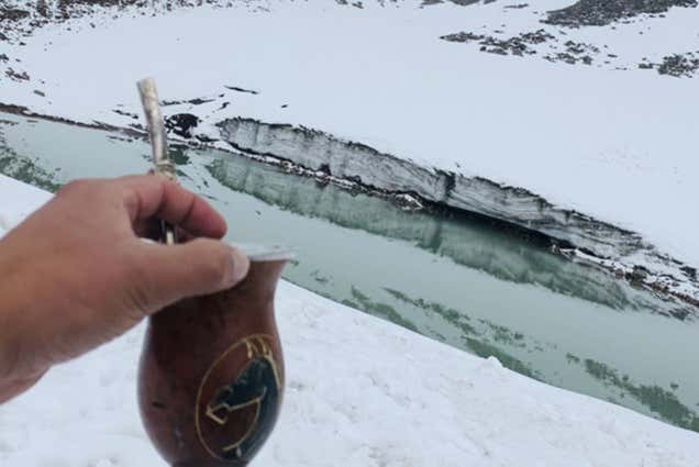 Enjoying a drink next to the frozen lagoon