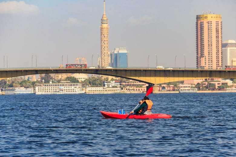 Paddling on the Nile River under Cairo's buildings