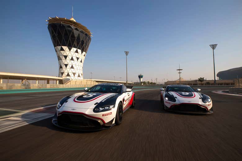 Driving an Aston Martin GT4 on a track at the Yas Marina Circuit