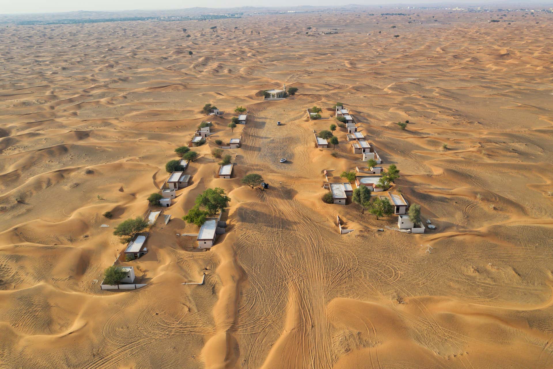 Al Madam Ghost Village Desert Safari + Sandboarding