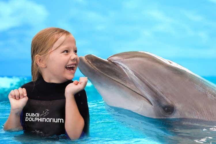 A girl having fun at the Dubai Dolphinarium