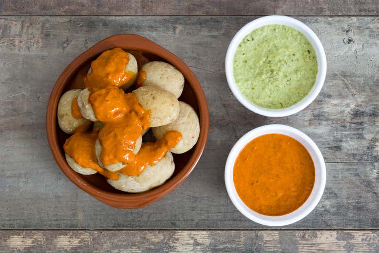 We'll try papas arrugadas (wrinkled potatoes) with mojo sauces