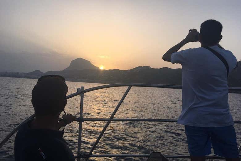 Take a picture of the sunset from the boat
