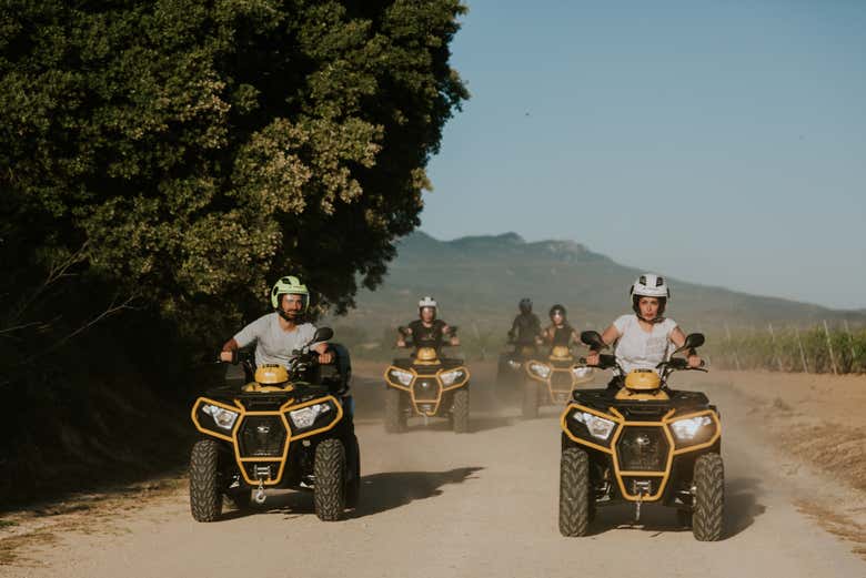 Ride the quad bikes along the dirt roads