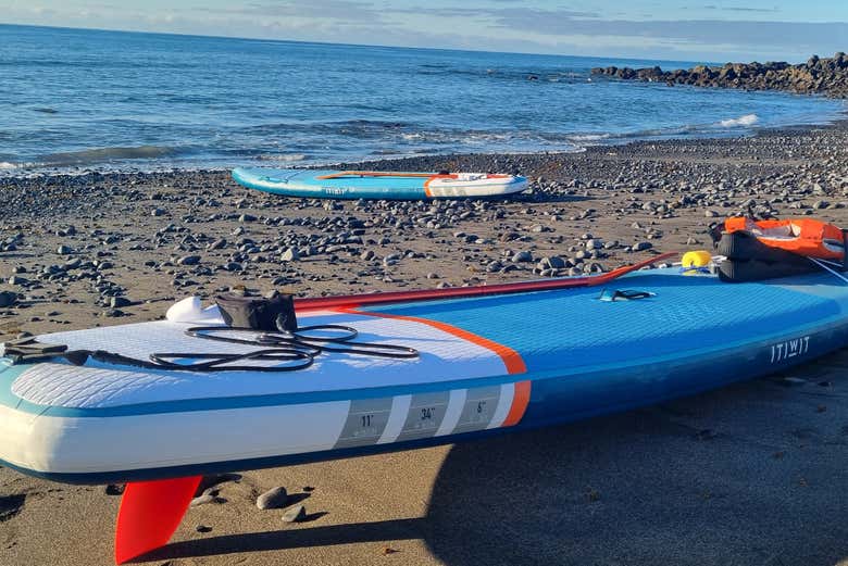 A paddle board on the beach