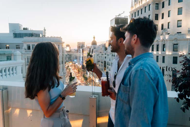 Enjoying a cocktail on a rooftop terrace