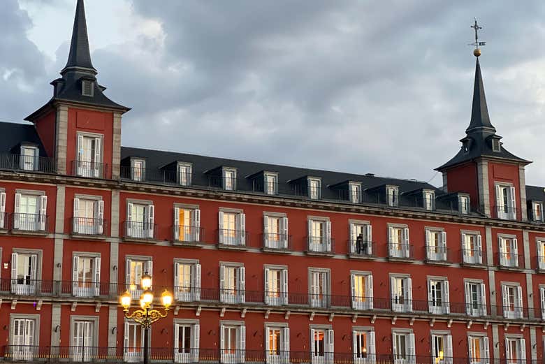 Admire Plaza Mayor at dusk
