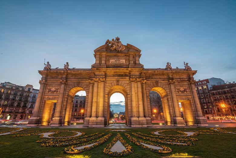 Marvel at the Puerta de Alcalá