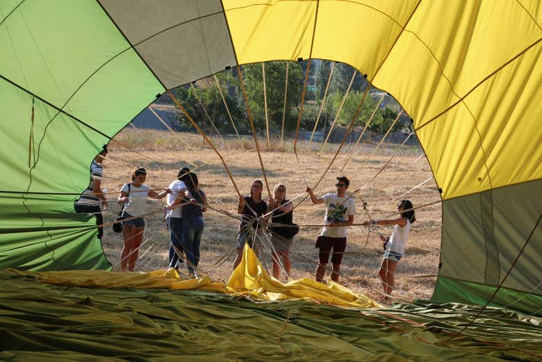 Helping to inflate the balloon