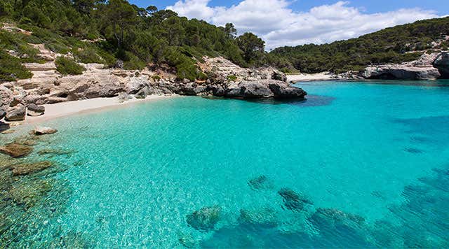 Golden sands and turquoise waters of Cala Mitjana