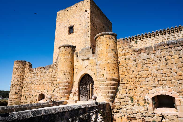 Walk through the entrance of the castle 