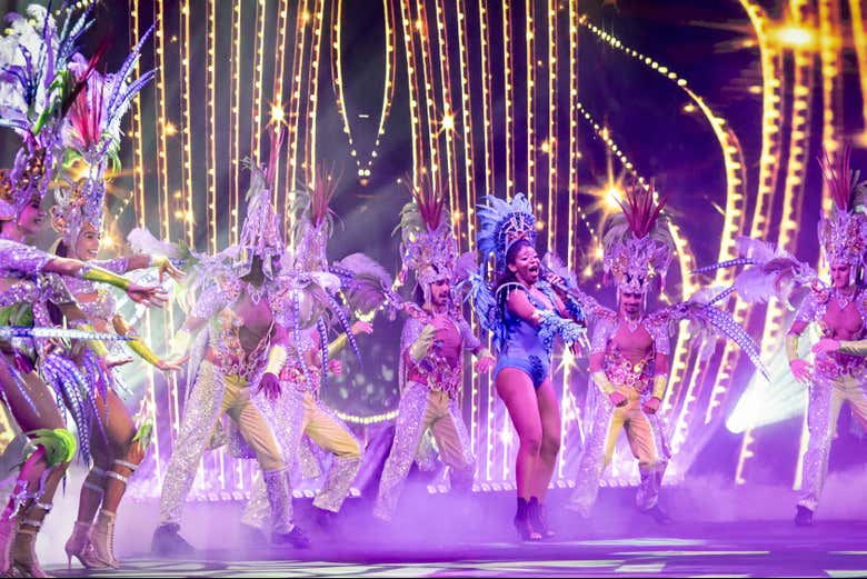 Marvel at the dazzling costumes and choreography