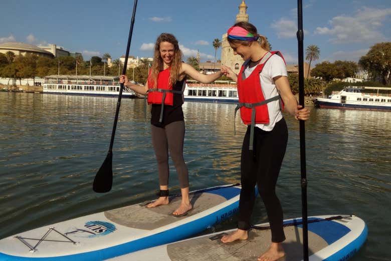 Paddleboarding next to the Torre del Oro