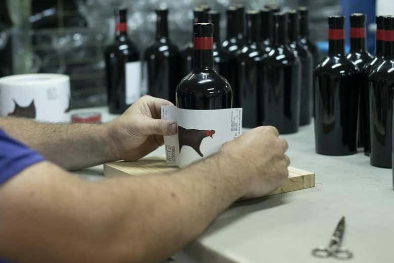 Labelling the bottles by hand
