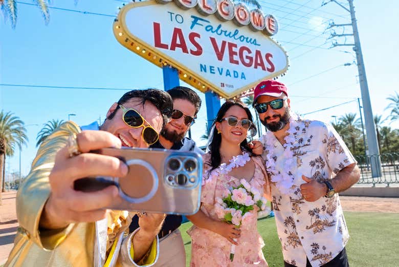Gold Elvis taking a selfie with group at the Fabulous Las Vegas 