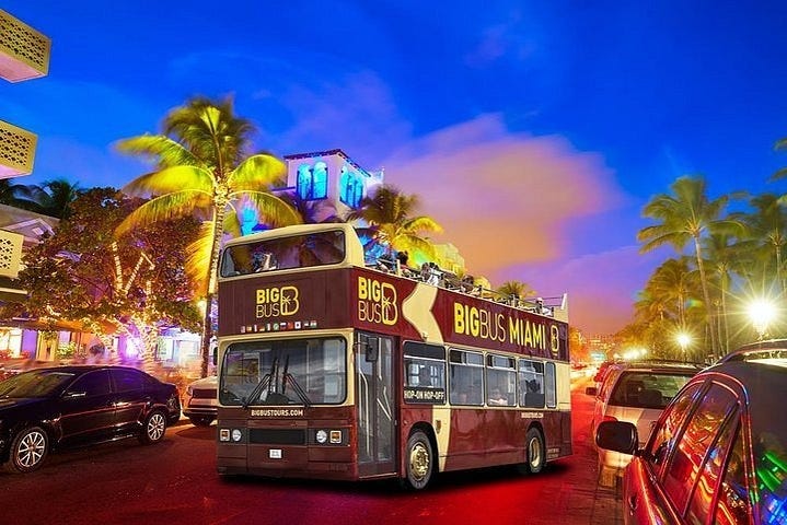Miami open-top sightseeing bus at dusk