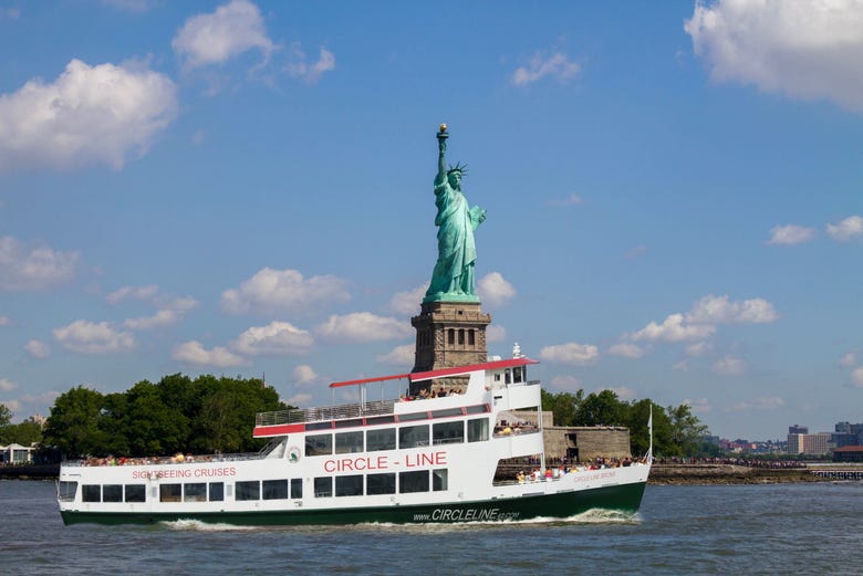 Boat passing by the Statue of Liberty