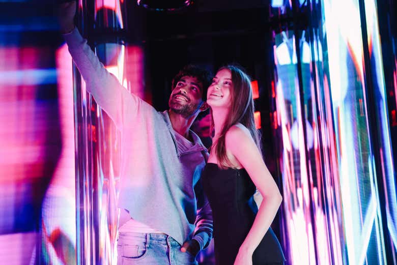 Pose in the vibrant light corridor at Edge