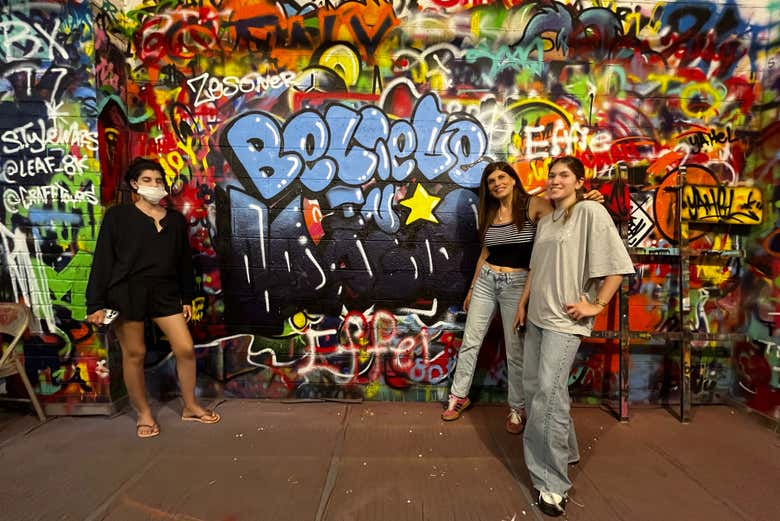 Pose next to some street art