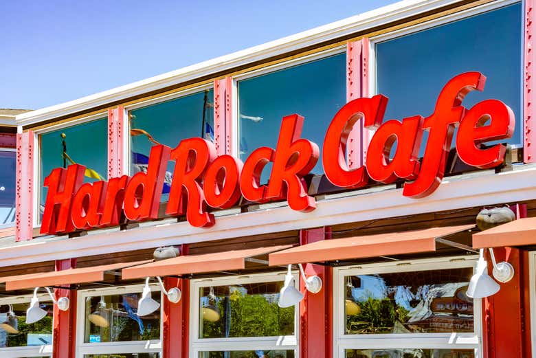 Take a picture in front of the Hard Rock Cafe San Francisco sign