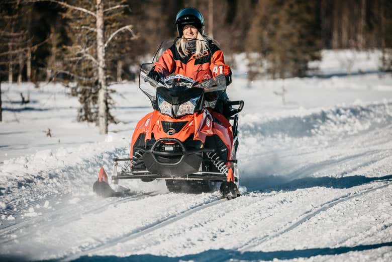 Riding snowmobiles in Finland