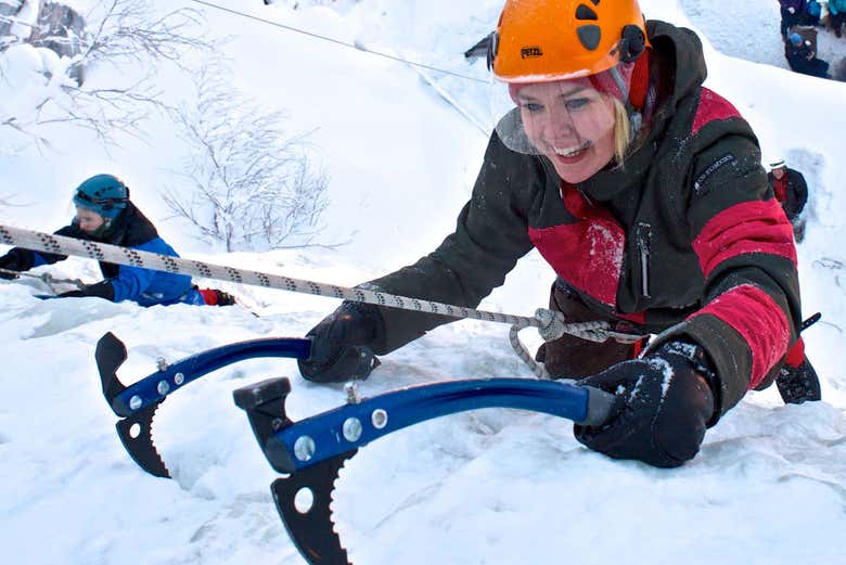Using the ice axes to climb