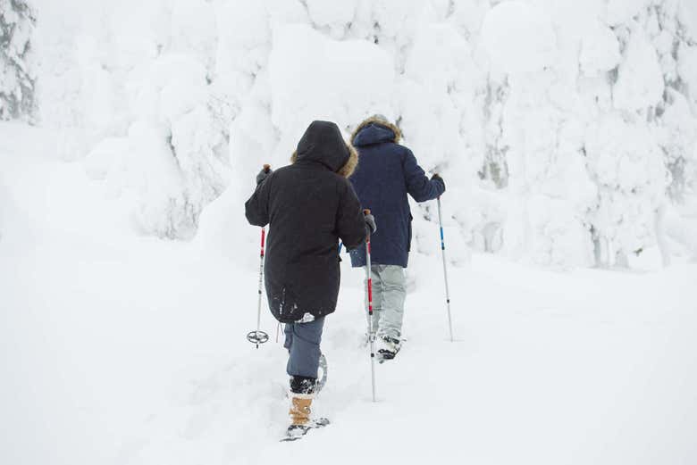 With the snow shoes