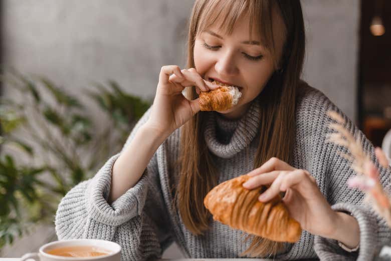 Enjoy a croissant with a coffee