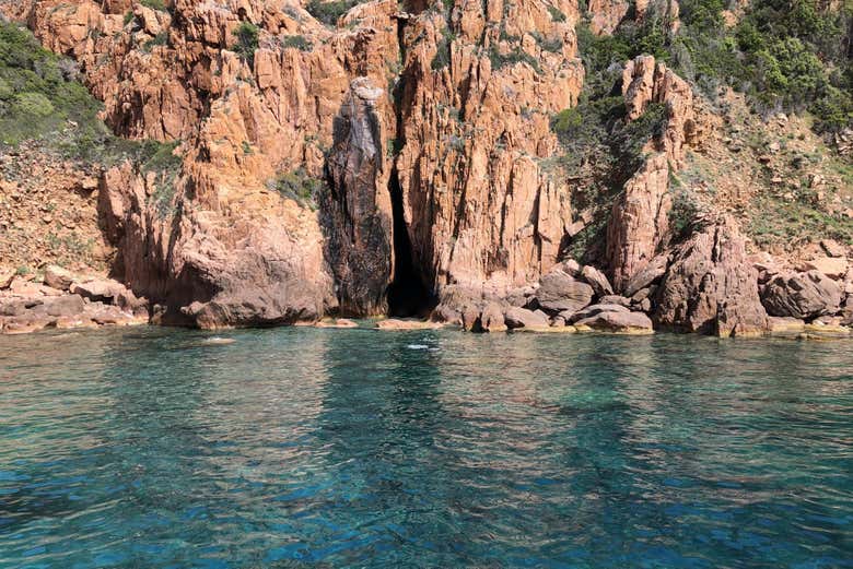 Admire the crystal-clear waters and dramatic cliffs