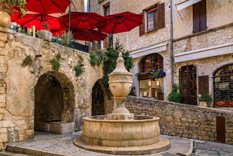 Stop at the village fountain in the heart of the old town