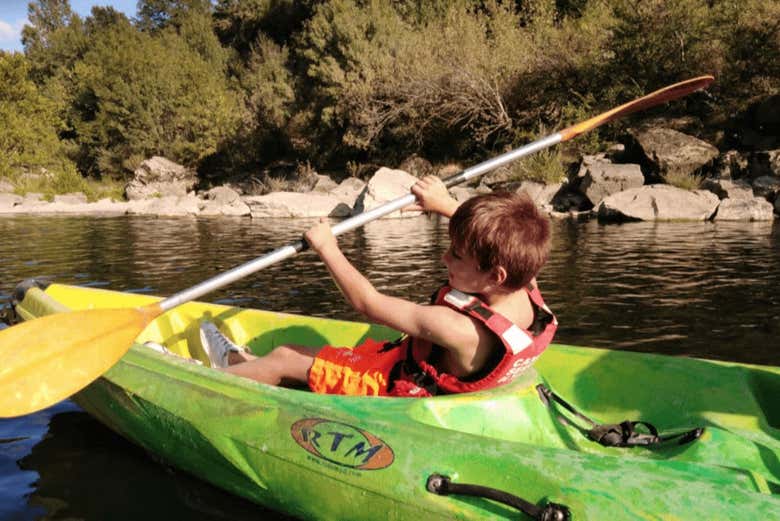 Child rowing in a kayak