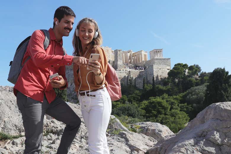 A couple using the Acropolis audioguide