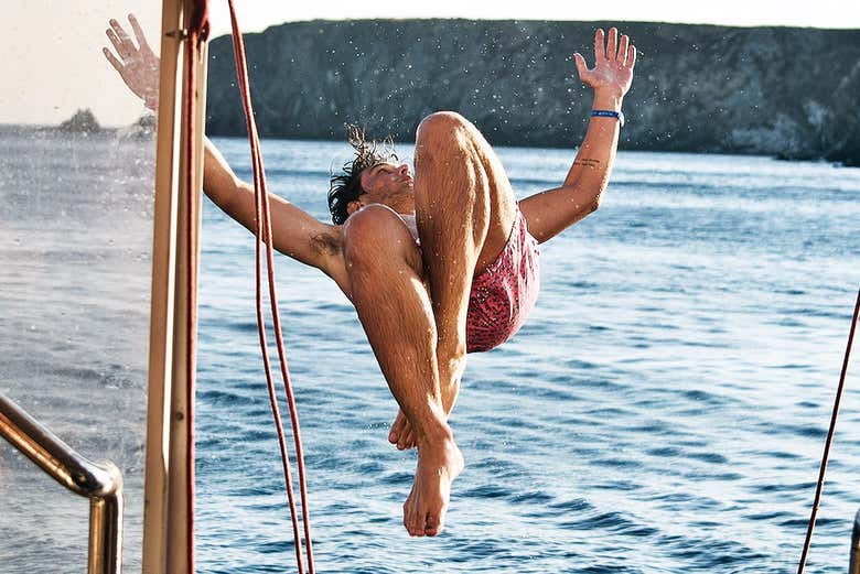 Daringly jumping off the boat