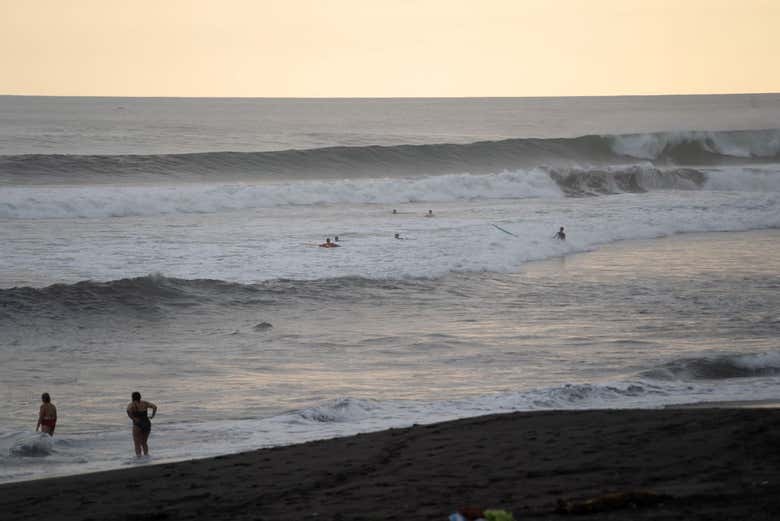 See the sunset at the beach