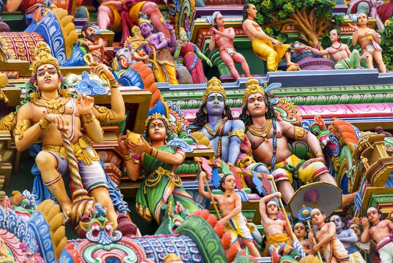 Admire the colorful sculptures that depict mythological stories