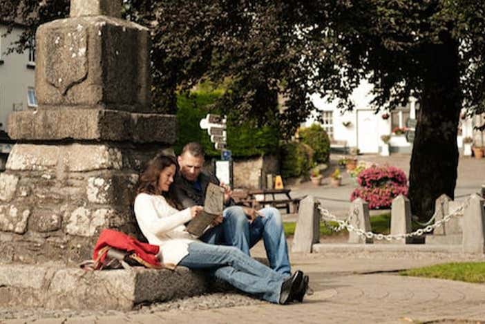 Couple relaxing by a statue