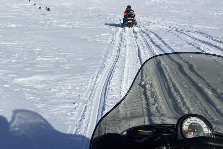 Gliding over the ice on the snowmobile tour